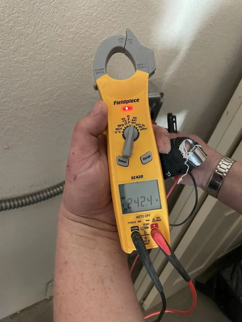 Voltage testing with clamp meter during Generator Installation in Hanson